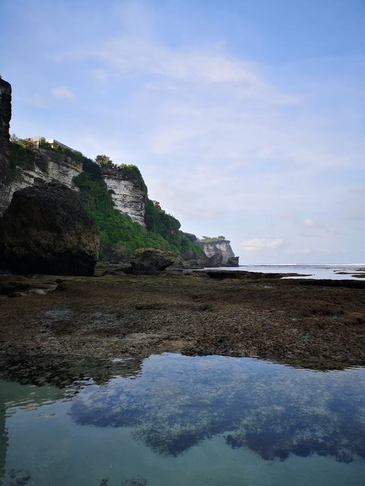 Rocky Uluwatu coastline with tide pools